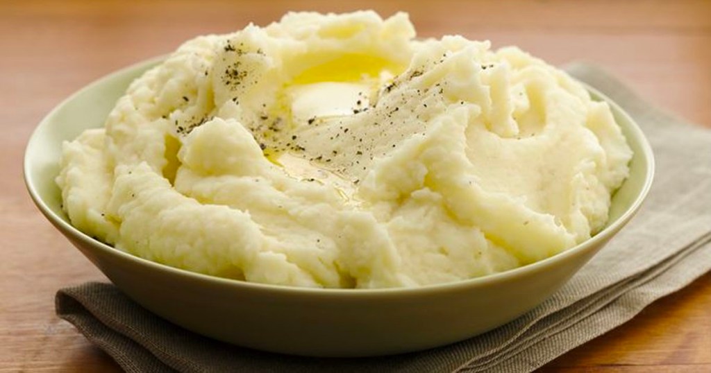 mashed potatoes in a green bowl