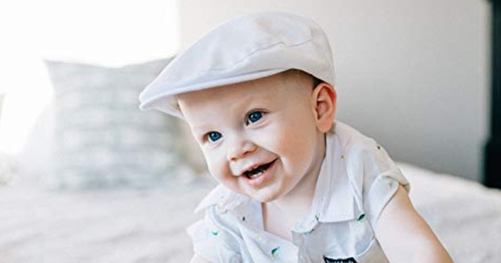 baby boy in white driver cap