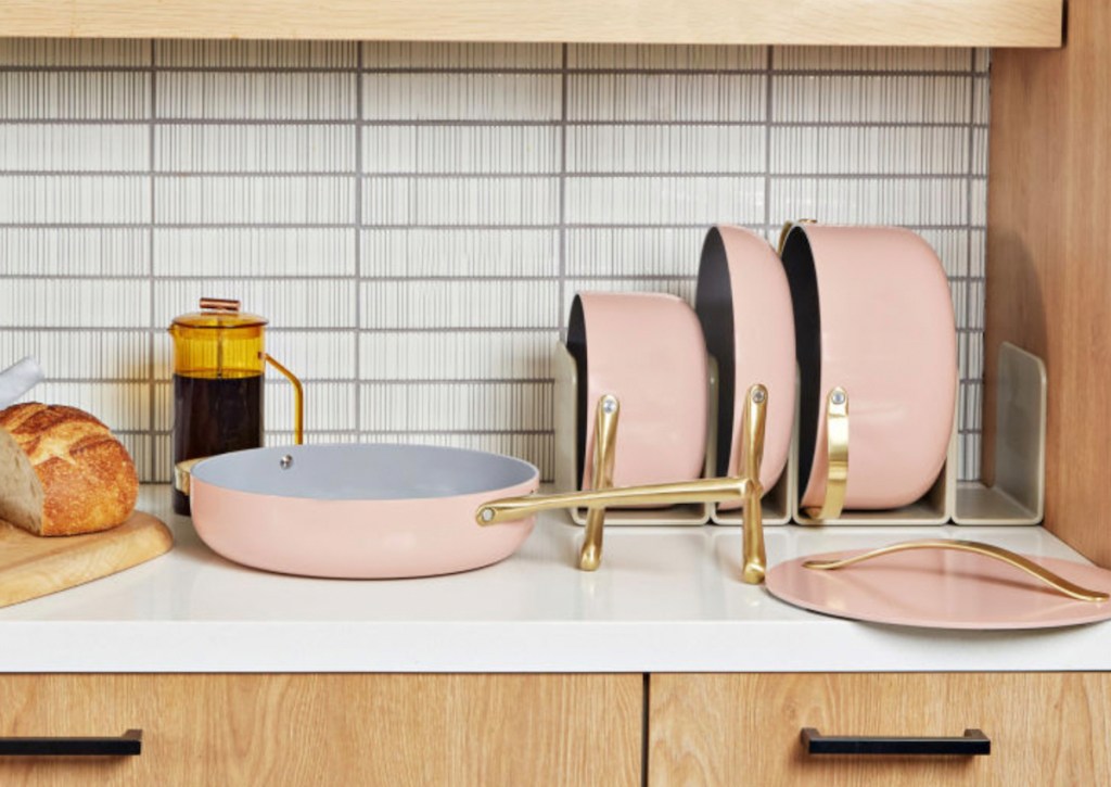 pink cookware set on kitchen counter