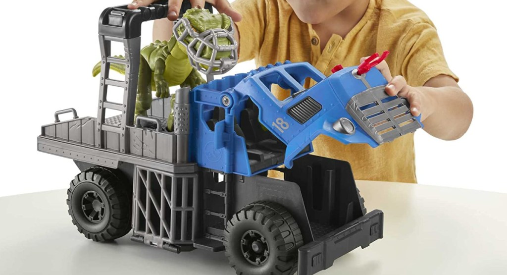 child playing with Fisher-Price Jurassic World Dominion Break Out Dino Hauler
