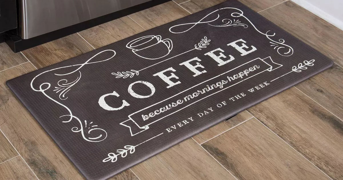 black kitchen mat that says coffee with coffee cup on it on wood floor