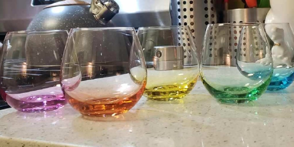 colorful stemless glasses on counter