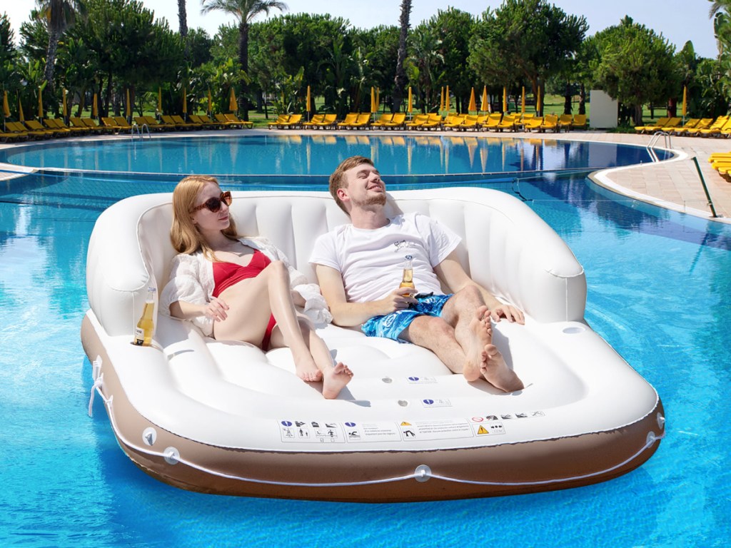two people in a costway pool float
