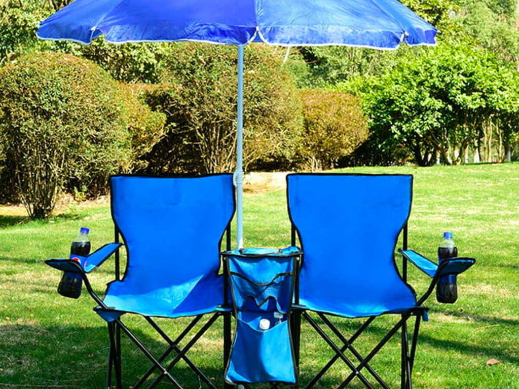 blue costway portable double folding chair with umbrella sitting in grass lawn