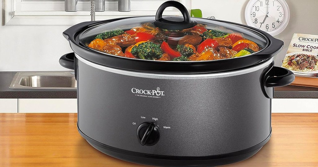 charcoal crockpot slow cooker with food inside