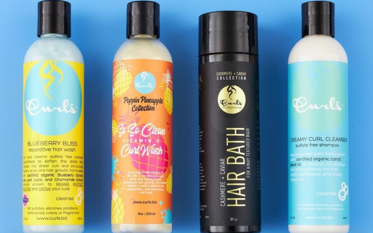 four curly haircare products side by side