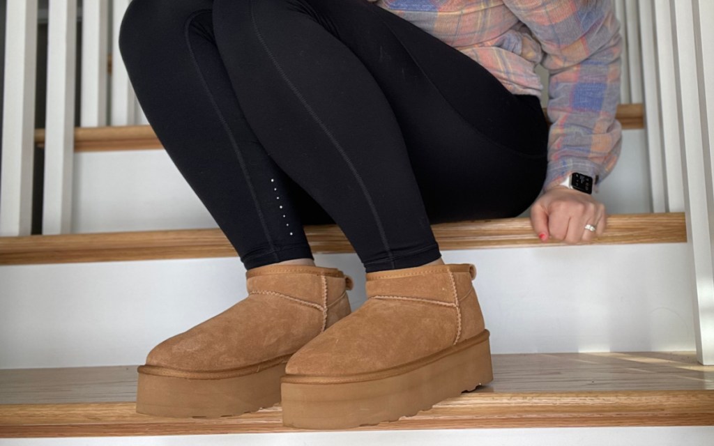 woman sitting on stairs in platform boots