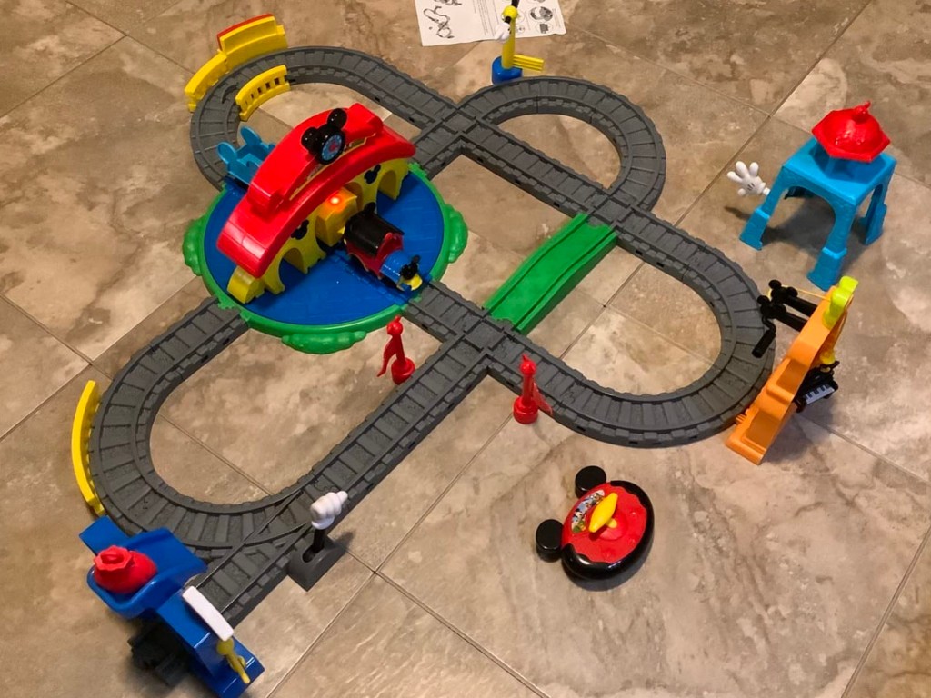 mickey mouse train track put together on floor