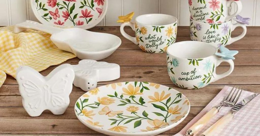 butterfly and floral dinnerware and white dinnerweare on wood table
