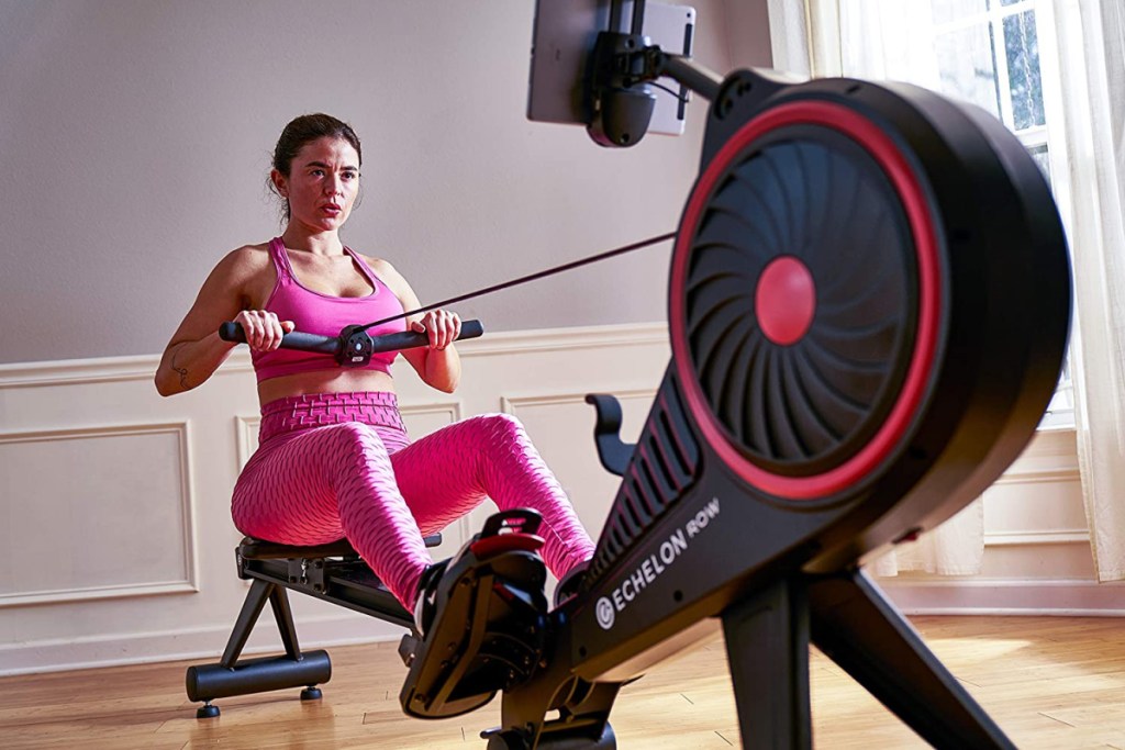 woman on an echelon fitness machine