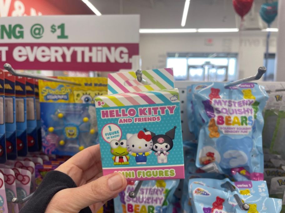 hand holding a pack of Hello Kitty Mini Figures