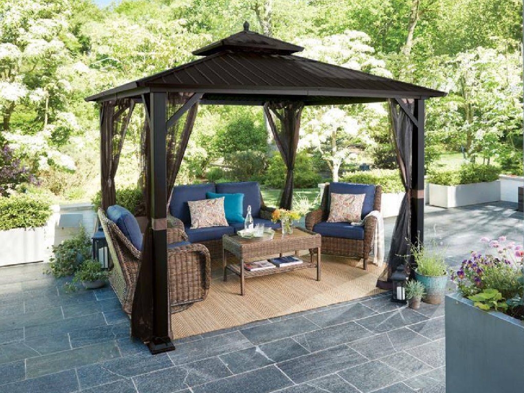 gazebo with chairs under it