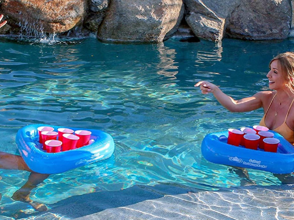 girls in the pool playing with GoPong Pool Pong Racks