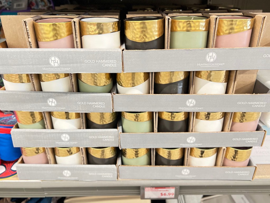 shelf full of gold hammered huntington homes candles