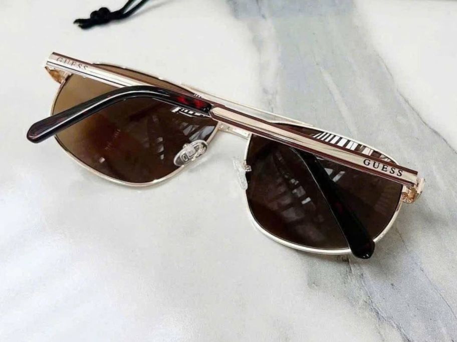 guess glasses laying on counter