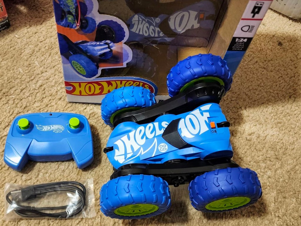 hot wheels RC twister with remote, and cord laying next to box