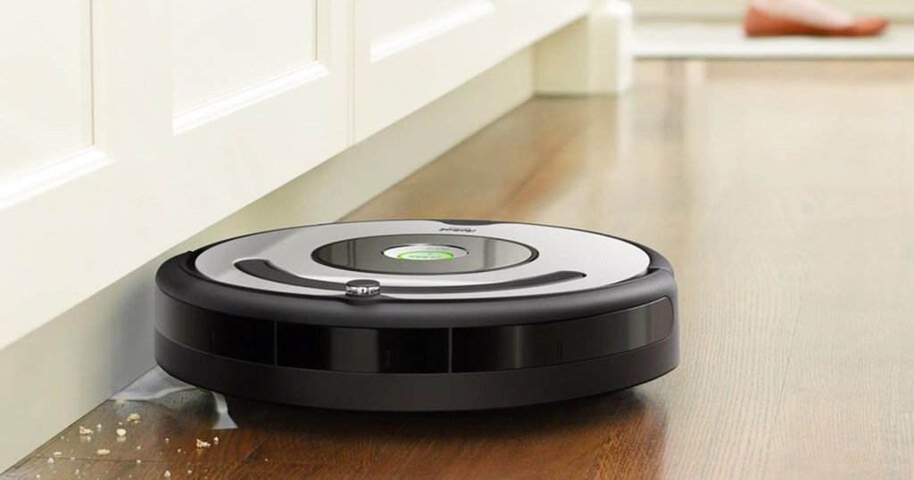 roomba sweeping up crumbs in kitchen