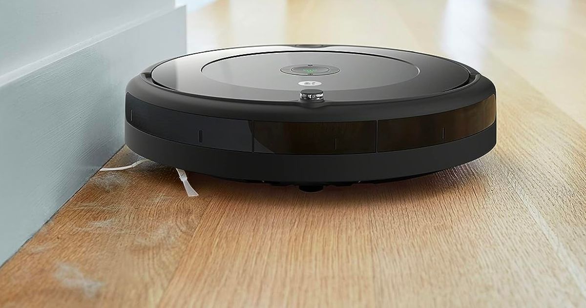 iRobot Roomba 694 Robot Vacuum with Wi-Fi Connectivity vacuuming pet hair along a base board