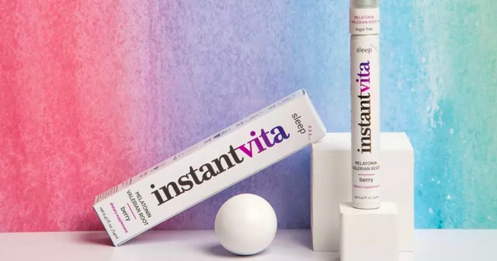instantvita multivitamin spray on stand next to box