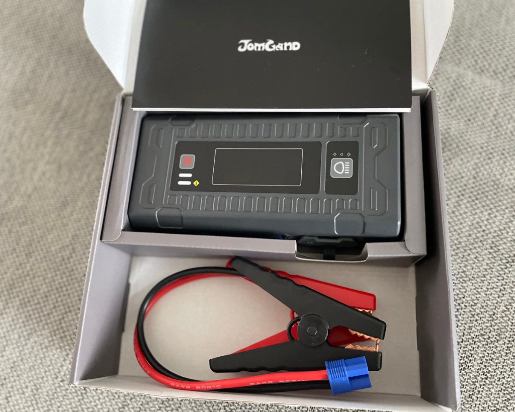 portable jump starter with cables in box