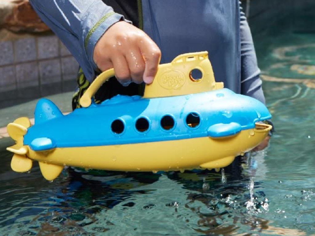 kids playing with Green Toys Submarine in the pool