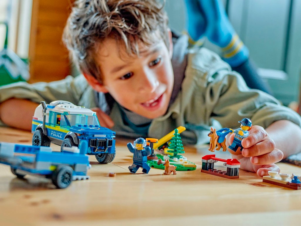 child playing with lego city policy set