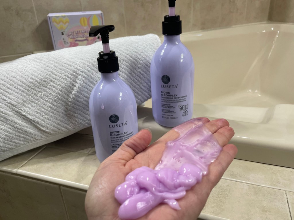 purple shampoo in hand