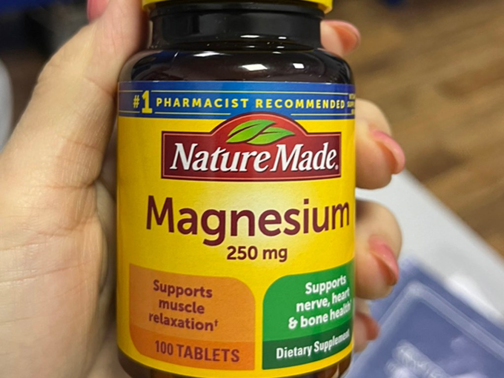 hand holding nature made magnesium