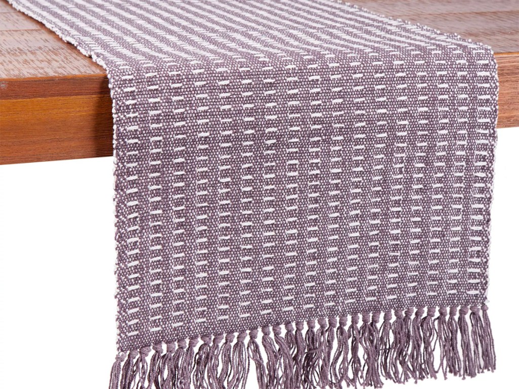 purple table runner hanging off table