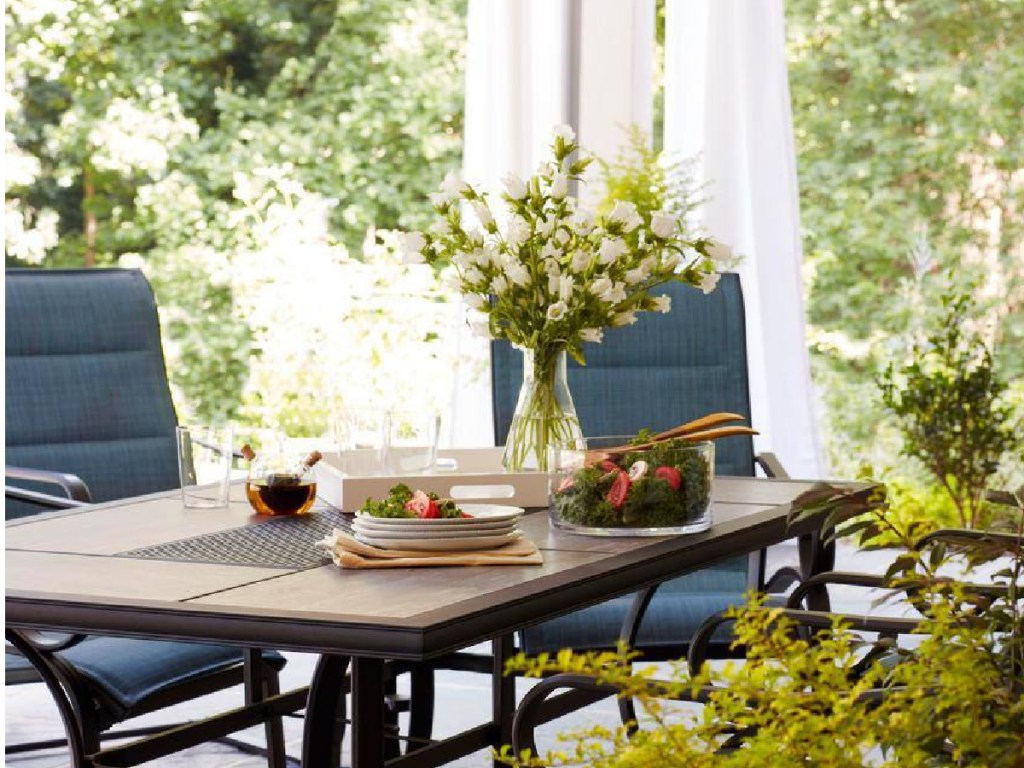 patio dining table in backyard with chairs