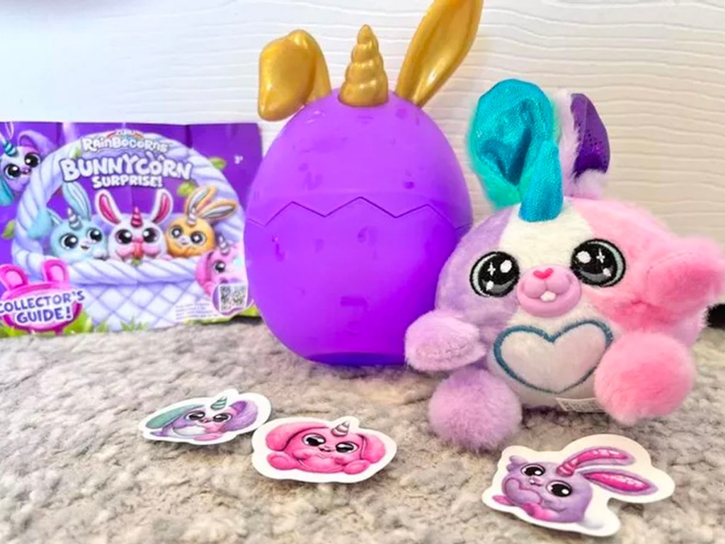 purple and pink rainbocorn plush toy, stickers and box