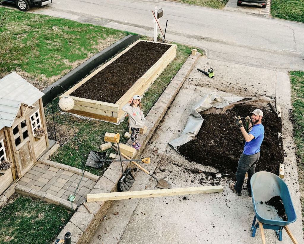 aerial photo of raised garden bed and soil compost on driveway