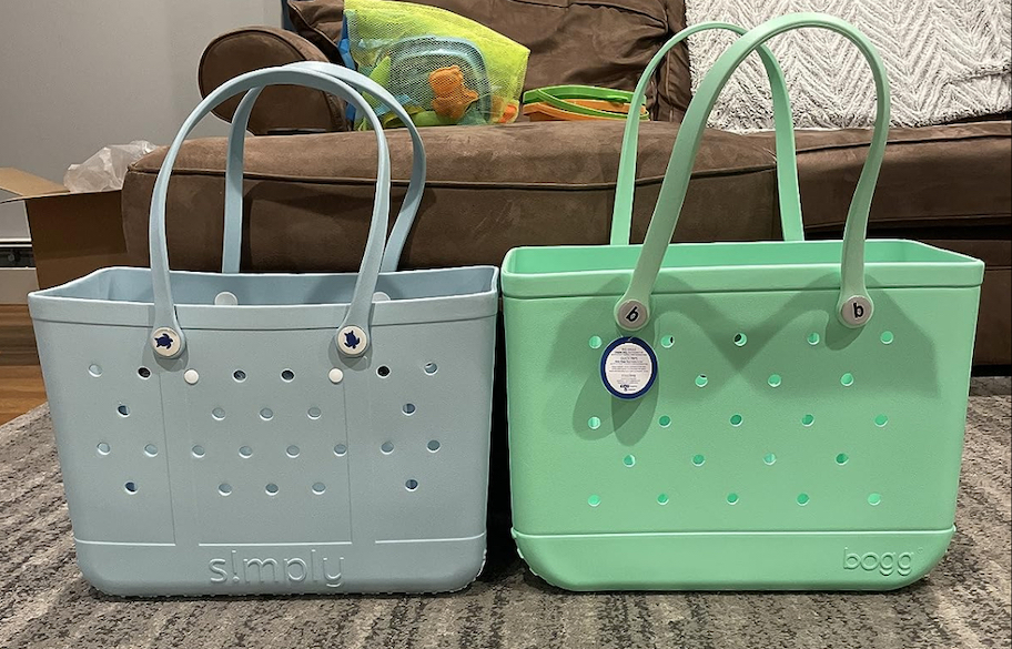 blue and green rubber beach totes sitting on rug next to each other