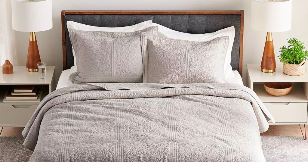 gray and white sonoma bedding set on bed