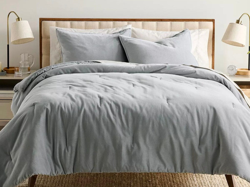 gray velvet comforter set on bed 