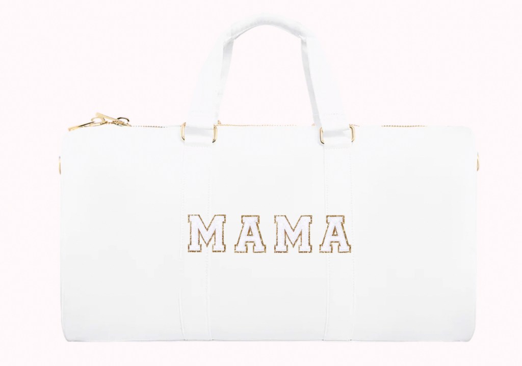 white duffle bag with mama patches on front