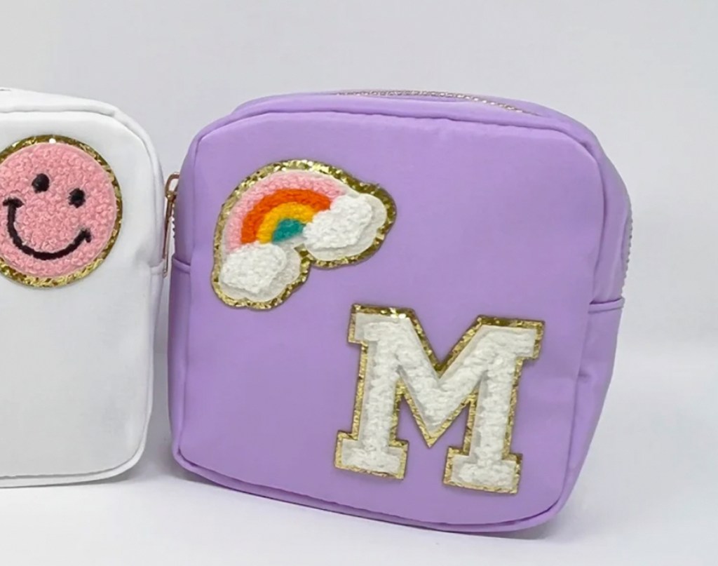 purple small zipper pouch with m and rainbow pouches