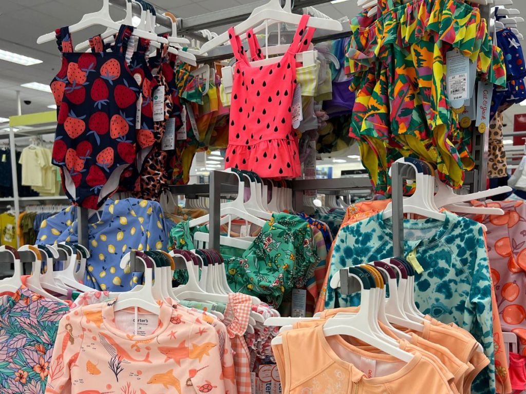 rack of girls swimsuits hanging in Target store