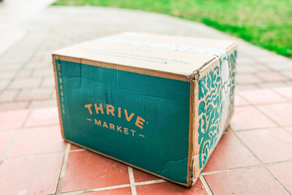 thrive market box on red brick doorstep