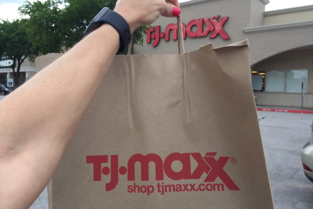 TJ Maxx bag held up by the storefront Store