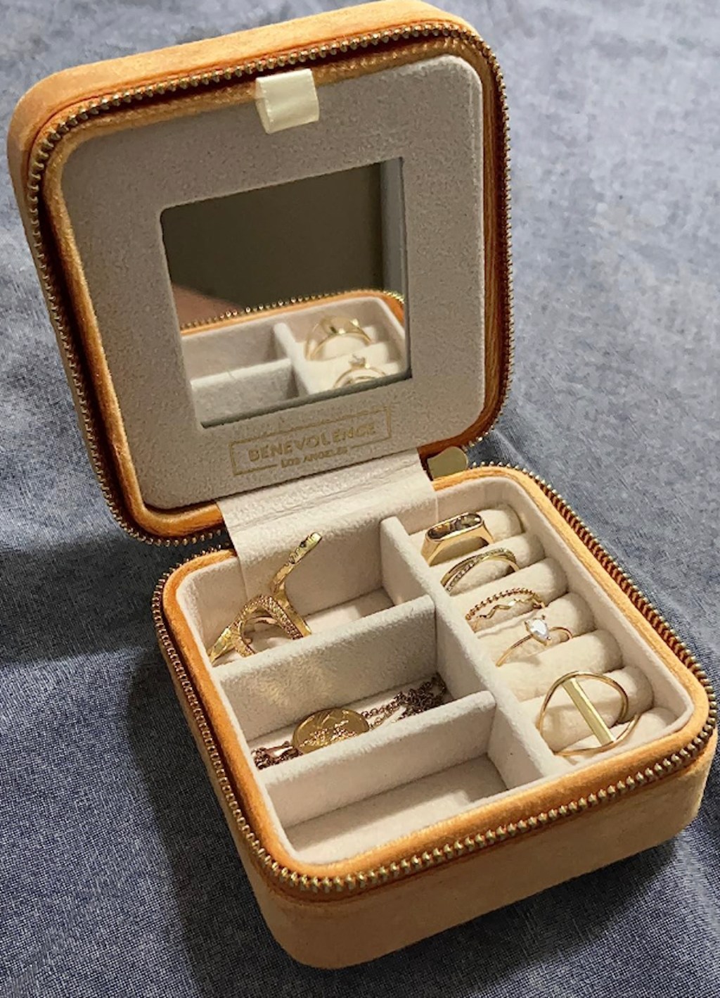 camel colored travel jewelry box organizer with gold jewelry inside