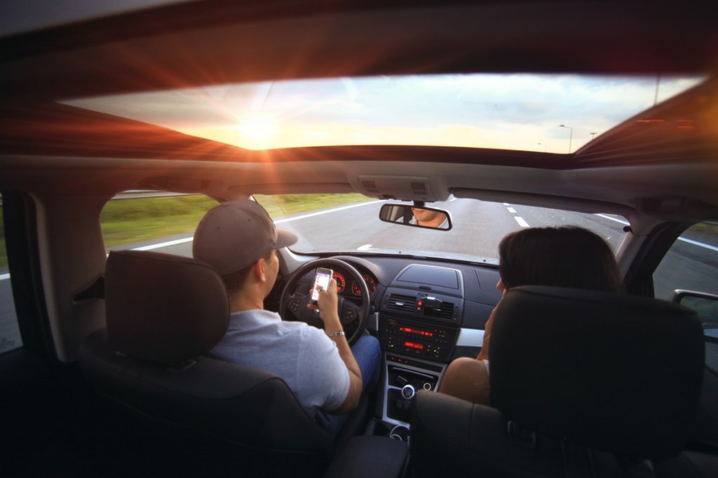 Two people driving in a car