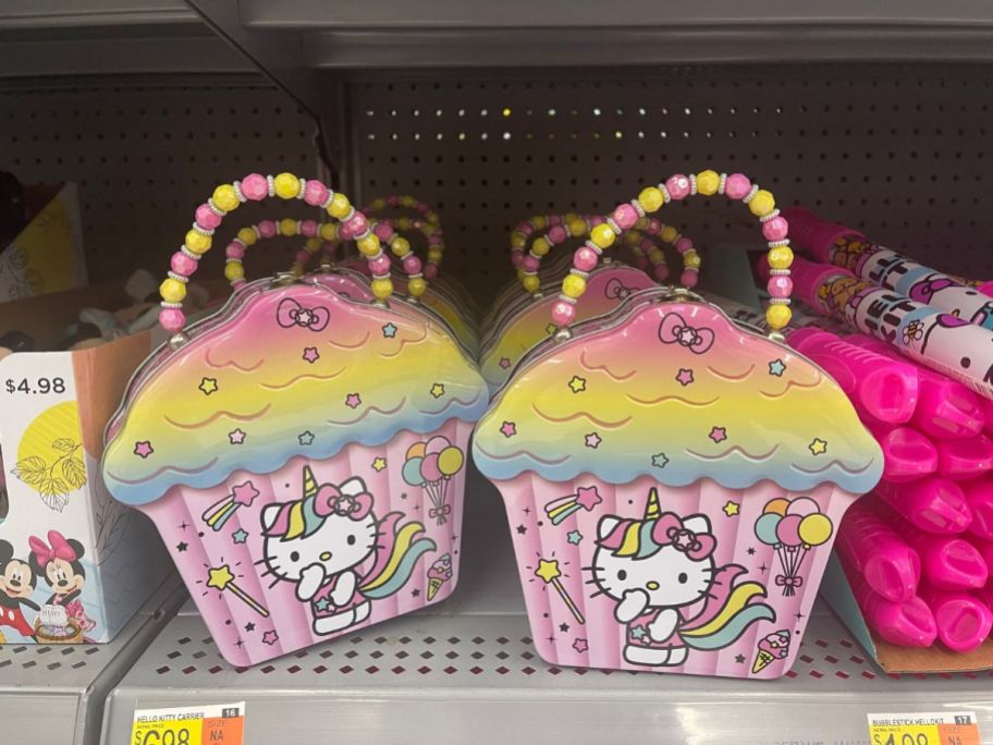 colorful Hello Kitty cupcake shaped lunch boxes / tins on shelf