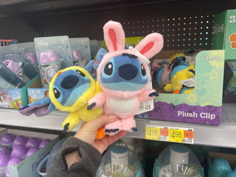 hand holding Disney plush Stitch in Easter outfits