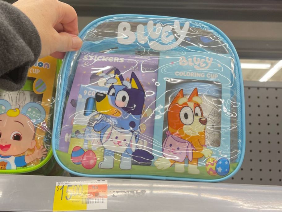 hand reaching for a Bluey Backpack Easter Gift Set on shelf