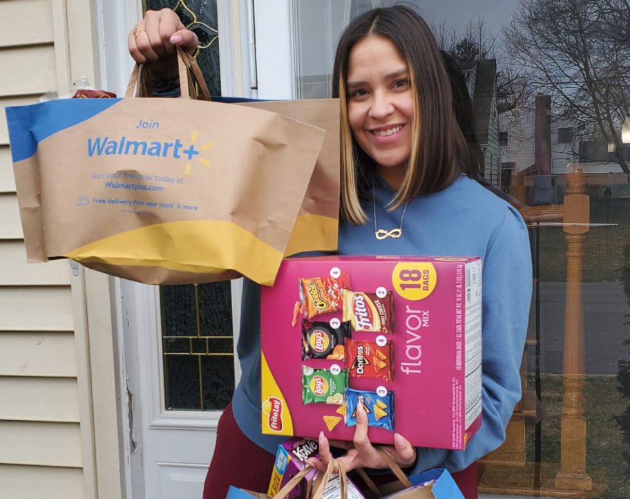 woman carrying her walmart plus delivery for mothers day gifts 2023