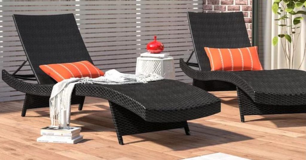 2 dark brown chaise loungers on patio 