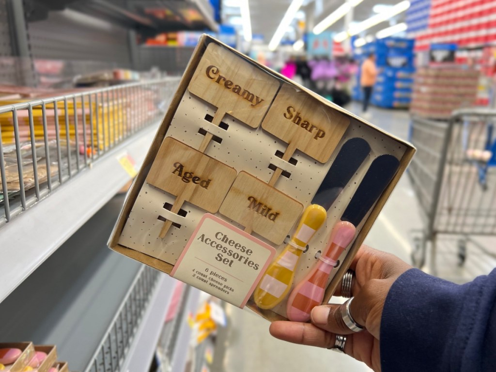 woman holding cheese accessories set at Walmart