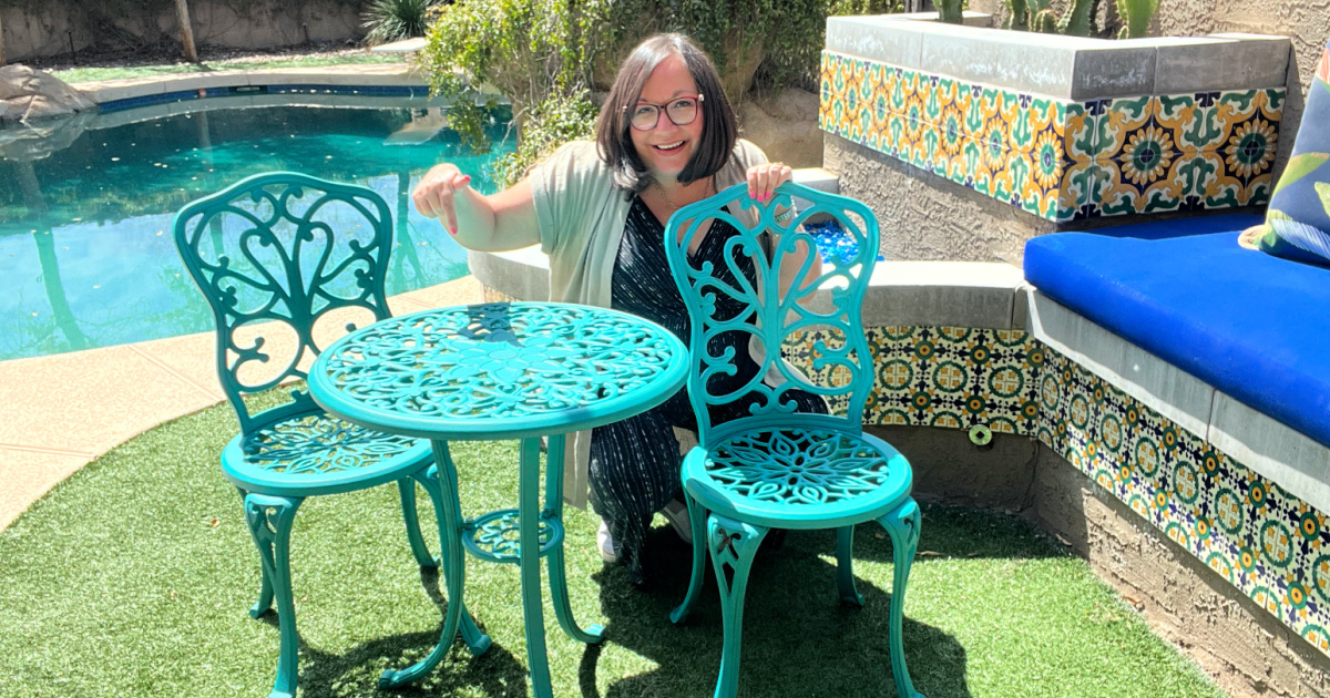 woman pointing to a pioneer woman patio set