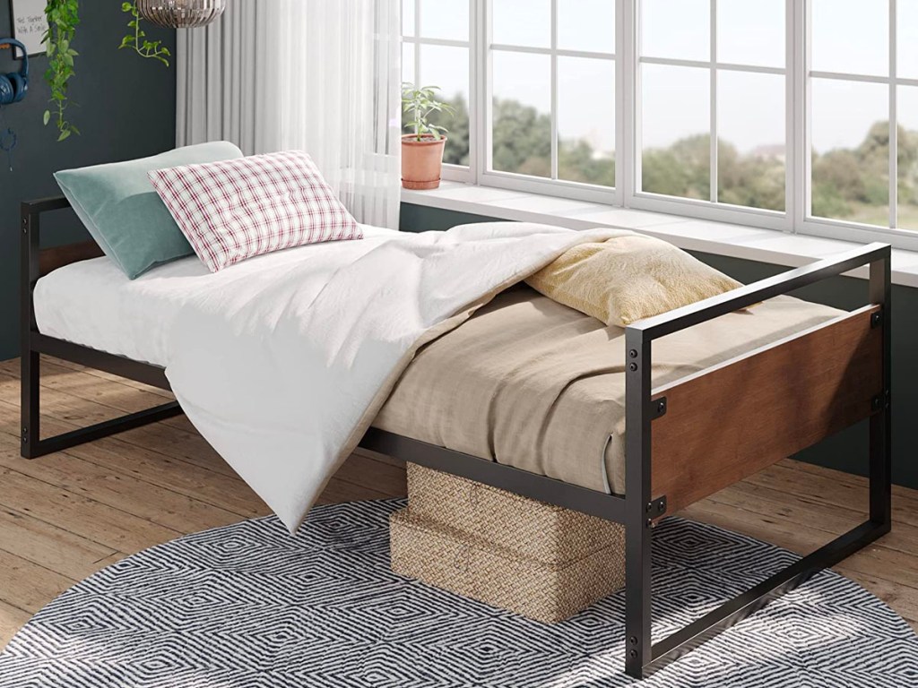 metal and wood daybed bedframe with white and tan comforter set